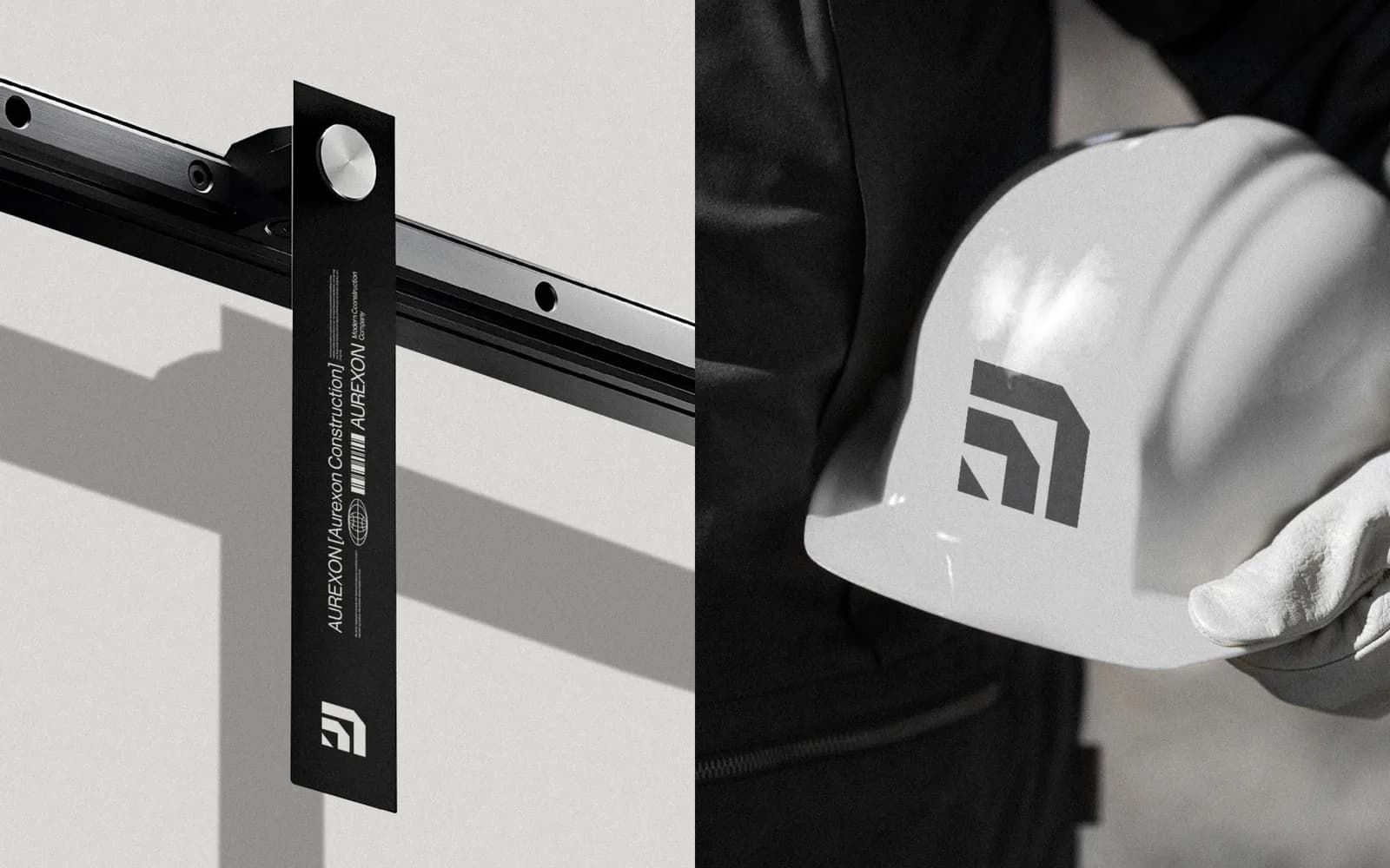 A black Aurexon hanging tag with the symbol at the bottom, clipped to a steel rail, beside a white hard hat held under an arm with the grey symbol printed on it.